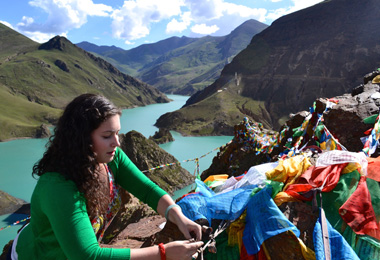Hanging prayer flags in Tibet