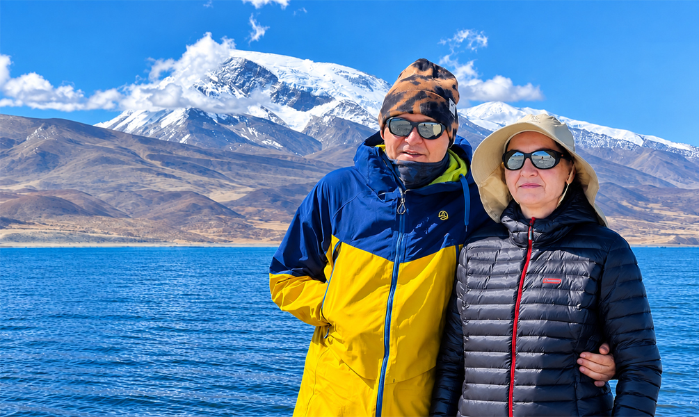 Travelers at Lake Manasarovar after Mount Kailash trek