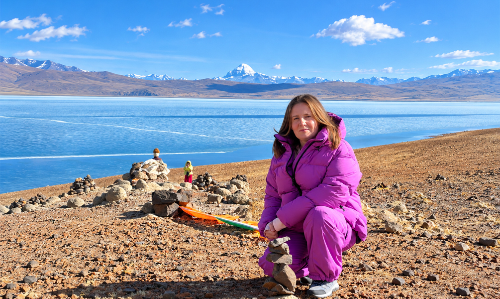 Traveler by Lake Manasarovar with Mount Kailash in the distance
