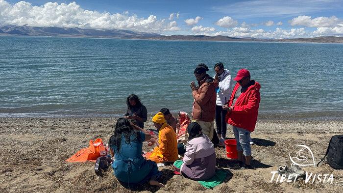 Our guests meditate by the Lake Manasarovar