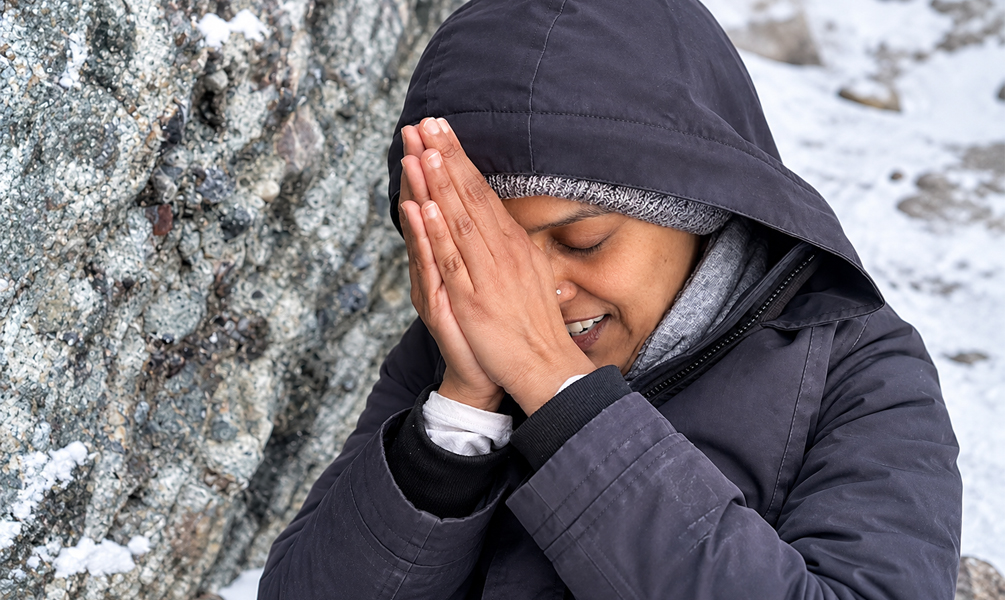 Pilgrim praying during the sacred Mount Kailash Kora in Tibet