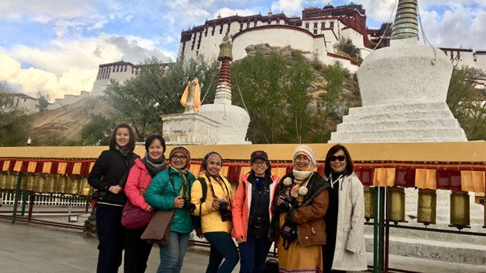Our clients dressed in down jacket in Lhasa in April