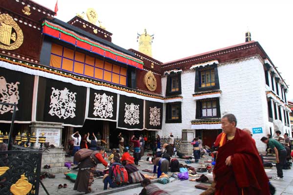 Pilgrims are making prostrating at the front of Jokhang Temple.