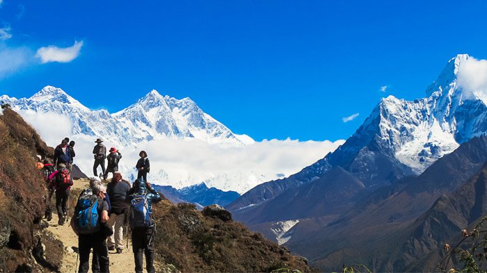 Tourists are trekking in Nepal.