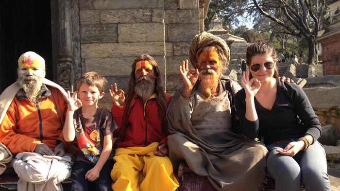 Tourists are having fun with Nepali monks.