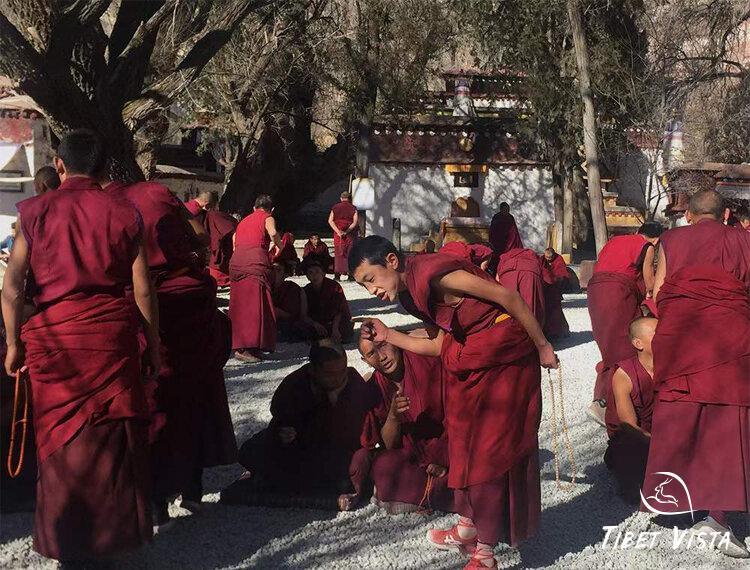 witnessing monk debates at Sera Monastery in Lhasa.