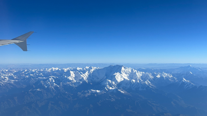 Fly to Tibet over snow-capped mountains