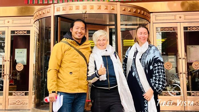 Our local Tibetan guide helps our guests check in at hotels in Lhasa