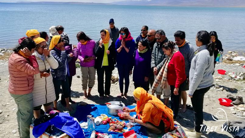 perform holy ritual for saga dawa festival at lake manasarovar