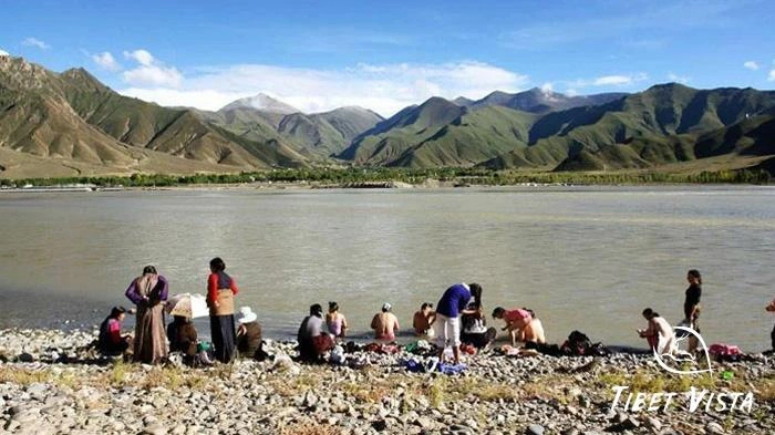 Tibetans gather at the Lhasa River for the Bathing Festival
