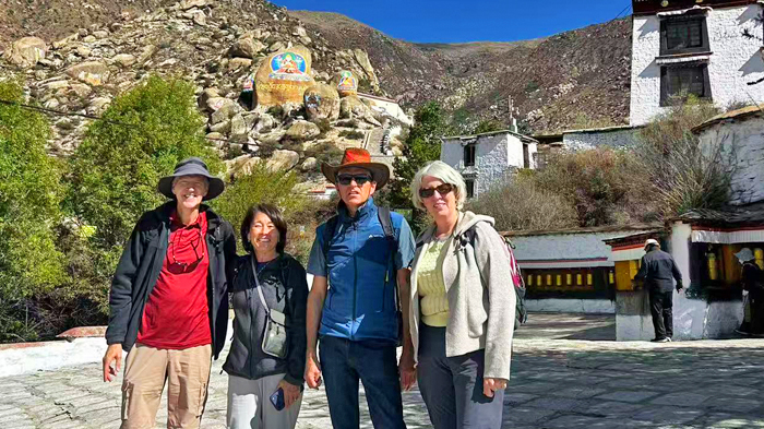 Visit the giant rock painting on the rock face of Drepung Monastery