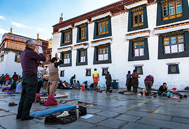 Sincere pilgrims prostrating in front of Jokhang Temple