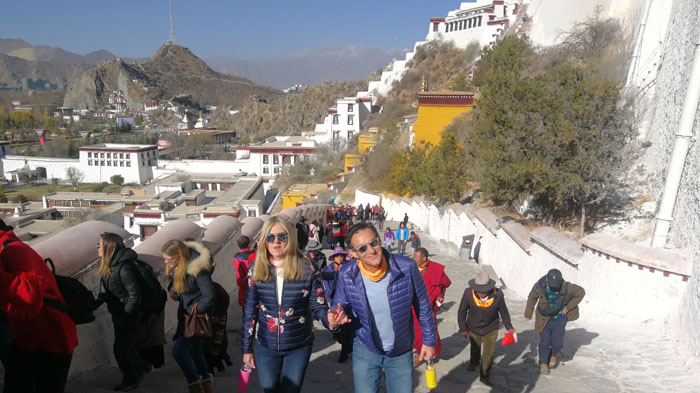 Climbing the long stairs to visit Potala Palace