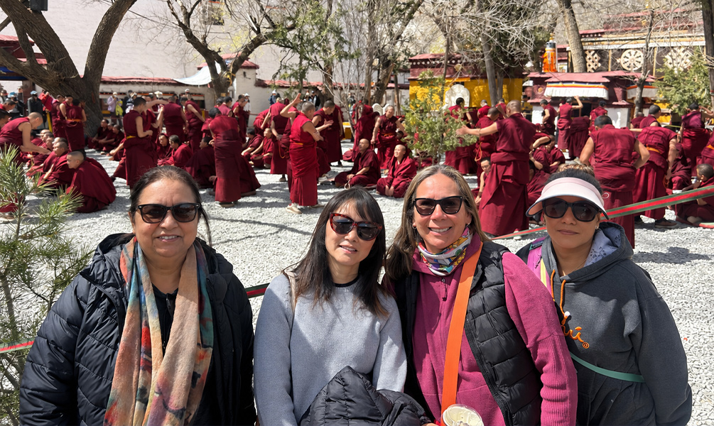 Travelers Watching Monk Debates at Sera Monastery