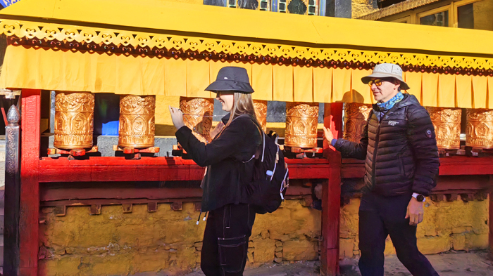 spin prayer wheels along the Barkhor street