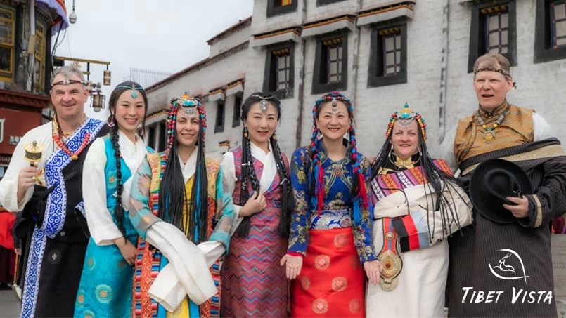 guests dressed in traditonal tibetan clothes