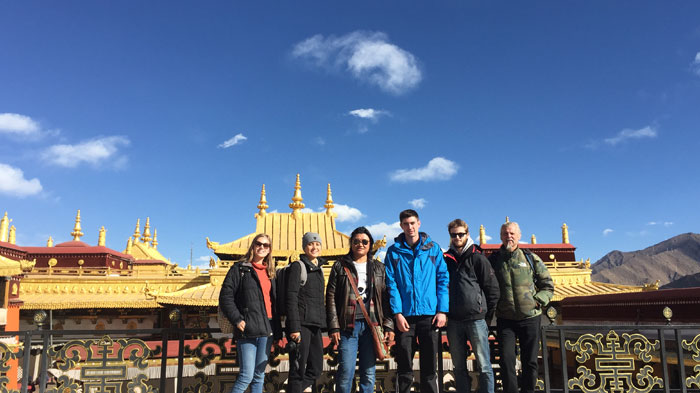 Taking a photo with the golden roof of Jokhang Temple