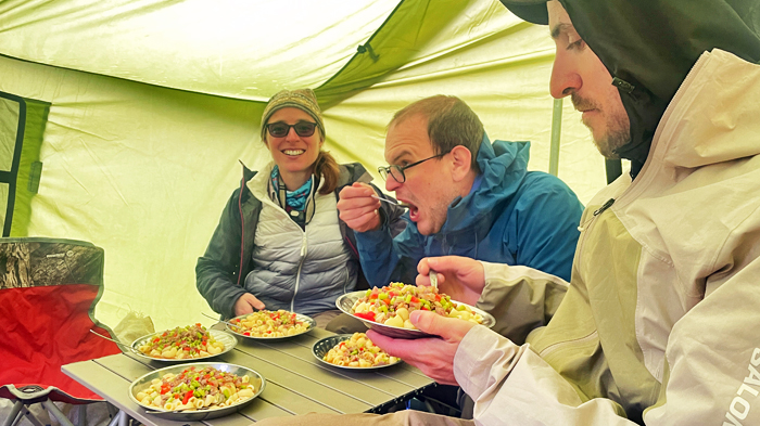 enjoy a tasty dinner in the cozy tent during the trek