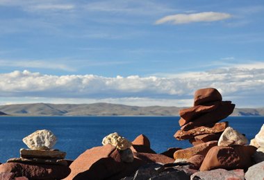 Piles of mani stones stand along Namtso Lake.