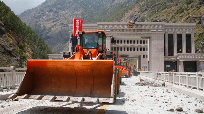 large vehicles to help clear the road at Gyirong Port.
