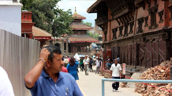 tourists and locals wander around Durbar Square in Kathmandu