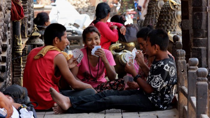 Locals are having their favourite pastime-playing poker.