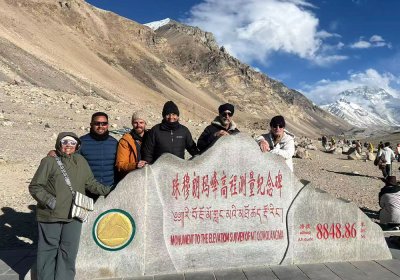 Traveler photo: Group photo at Everest base camp, with close-up view of the world's highest peak. (April 2026)	