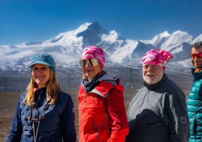 Traveler photo: Standing at Gawula Pass, guests frame themselves against Everest, freezing an amazing travel moment. (April 2026)