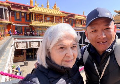 Traveler photo: In front of Jokhang Temple, a guest and their guide share a laughing selfie, capturing a lighthearted travel moment. (April 2026)