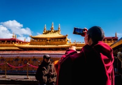Traveler photo: Tibetan monks in red robes taking photos at Jokhang temple, the spiritual heart of Tibet. (April 2026)	