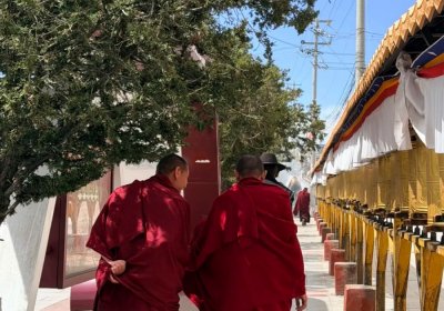 Traveler photo: Captured: two red-robed monks talking in low voices—perhaps discussing scriptures or simply sharing daily life. (April 2026)
