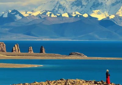 Traveler photo: Standing by the Namtso Lake and admiring the snow-capped mountains on the other side.(April 2025)