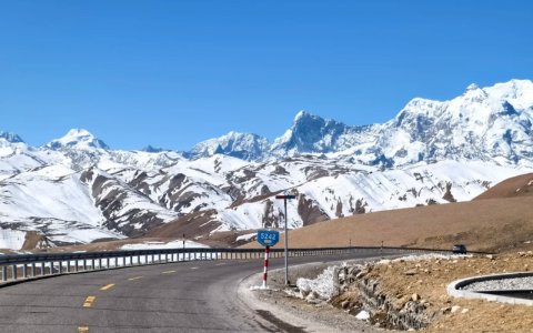 Traveler photo: The road winds through the valley toward silent snow peaks—like a staircase leading to the sky.  (April 2026)