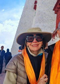 Traveler photo: Our beloved guests take pictures during their journey of climbing the Potala Palace, with the golden hada presented as a gesture of welcome. (April 2026)	