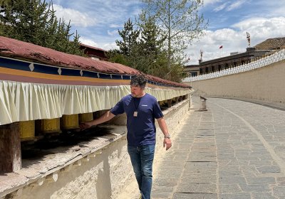 Traveler photo: Our beloved guests explore Tibetan monastery and roll the big praying wheels outside the monastery, praying for the blessings. (April 2026)	