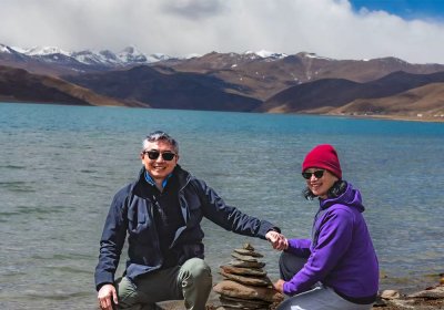 Traveler photo: Our beloved guests take pictures along the shore Yamdrok lake, one of the must visit attraction between Lhasa and Shigatse. (April 2026)	