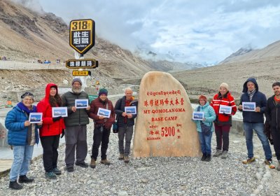 Traveler photo: Guests line up at the monument in Everest Base Camp, taking a meaningful group photo to mark the occasion. (August 2026)