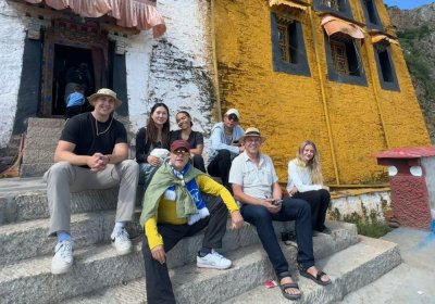 Traveler photo: Captured sitting on the temple steps, some guests sip water while others chat. (August 2026)