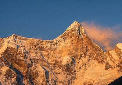 Traveler photo: At sunset, the golden glow fades from Namcha Barwa's peak as its ridges soften into twilight. (August 2026)
