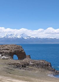 Traveler photo: The Holy Elephant Gate, a natural stone arch by Namtso Lake, is a landmark that offers stunning views of the sacred water and surrounding peaks. (August 2026)