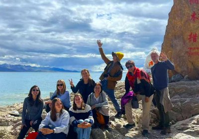 Traveler photo: Before Namtso's stone marker, every smiling face is the sweetest love letter to Tibet. (August 2025)