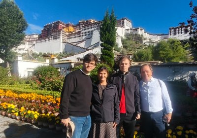 Traveler photo: Our travelers share a cheerful moment in front of the Potala Palace. (August 2026)
