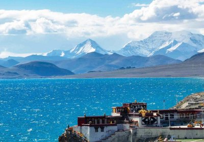 Traveler photo:  Snow mountains, sacred lake, and temple compose Tibet's most harmonious trio. (August 2025)