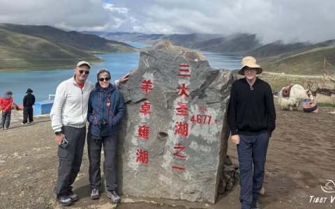 Traveler photo: Group photo by the shore of Yamdrok Lake, one of Tibet’s three holy lakes. (August 2025)