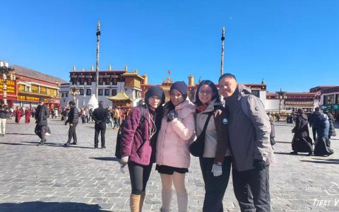 Traveler photo: On Barkhor Street in Lhasa, our guests take group photos on the bustling pilgrimage circuit. (December 2025)