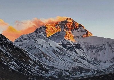 Traveler photo: Sunset casts a golden glow over the summit of mount Everest. (December 2025)