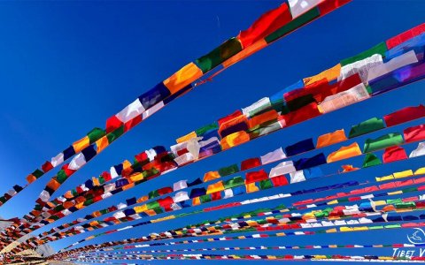 Traveler photo: Under azure skies of Tibet, colorful prayer flags dance like rainbows in the wind. (December 2025)