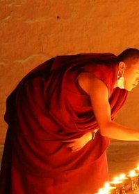 Traveler photo: Tibetan monk lights the butter lamp inside the monastery, praying the blessing for all the beings. (December 2025)	