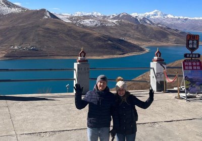 Traveler photo: Our beloved guests take picture along the shore of Yamdrok lake, one of the three holy lakes in Tibet. (December 2025)