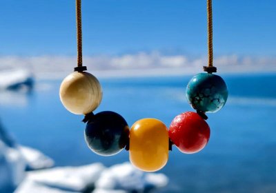 Traveler photo: By Namtso Lake in Tibet, souvenirs framed by holy lake and Nyenchen Tanglha snow mountains carry the plateau's purest blessings. (February 2026)